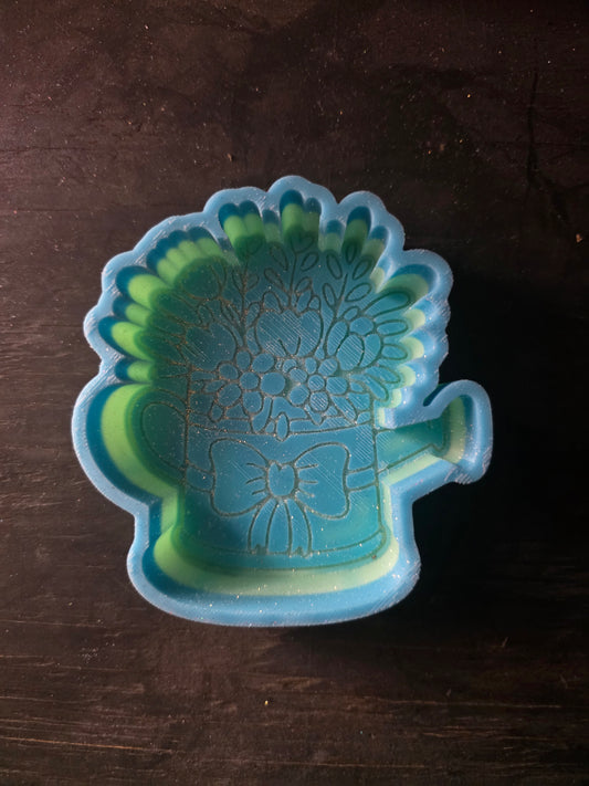 Watering can with flowers